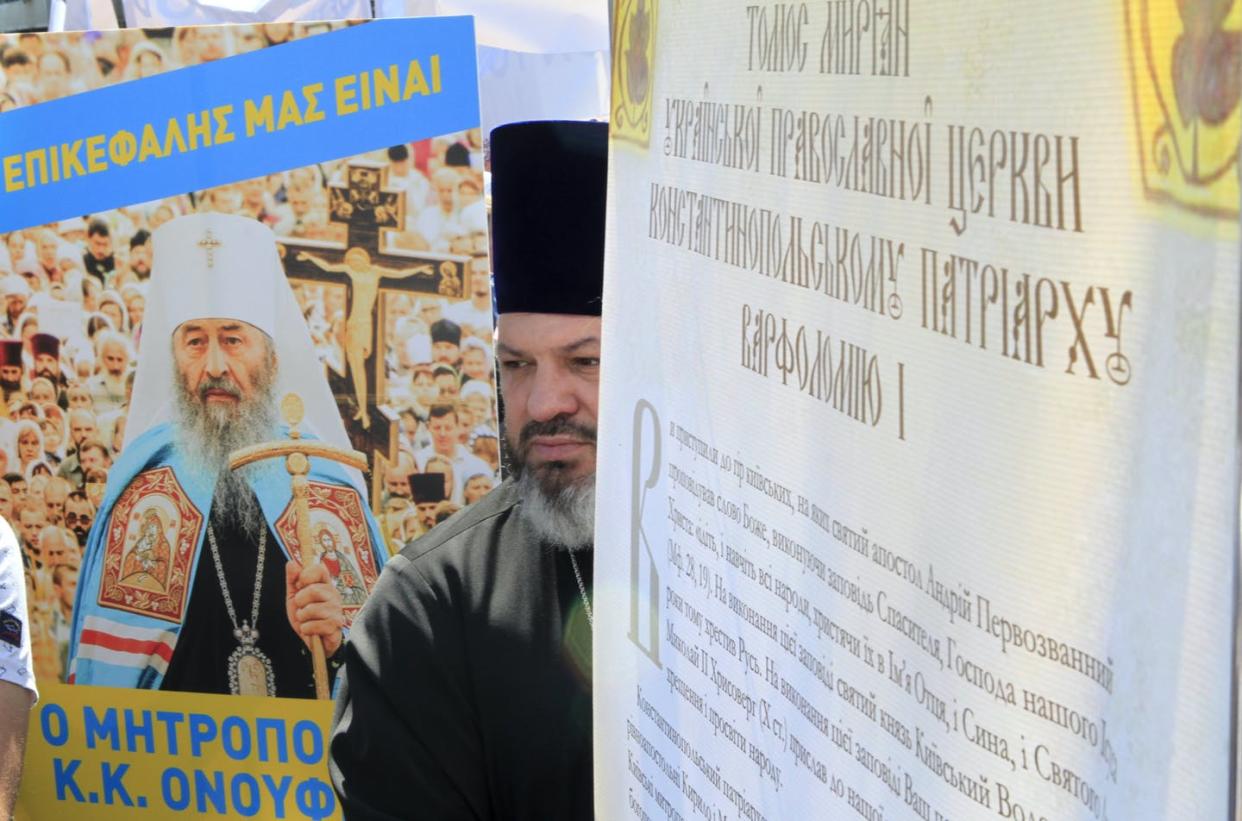 <span class="caption">An Orthodox priest takes part in a rally in protest against an official visit of Ecumenical Patriarch Bartholomew I of Constantinople to Kyiv in August 2021.</span> <span class="attribution"><a class="link " href="https://www.gettyimages.com/detail/news-photo/an-orthodox-priest-takes-part-in-a-rally-outside-the-news-photo/1234788699?adppopup=true" rel="nofollow noopener" target="_blank" data-ylk="slk:Anna Marchenko\TASS via Getty Images;elm:context_link;itc:0;sec:content-canvas">Anna Marchenko\TASS via Getty Images</a></span>