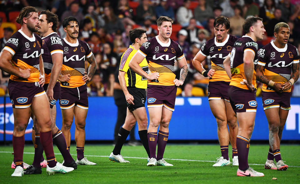 Broncos players, pictured here looking dejected during their loss to the Melbourne Storm.