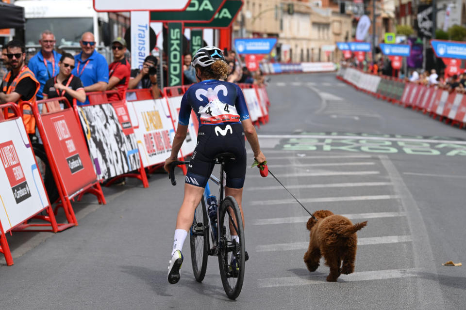 LA RODA SPAIN  MAY 03 Floortje Mackaij of The Netherlands and Movistar Team and her dog after the 9th La Vuelta Femenina 2023 Stage 3 a 1578km stage from Elche de la Sierra to La Roda  UCIWWT  on May 03 2023 in La Roda Spain Photo by Dario BelingheriGetty Images