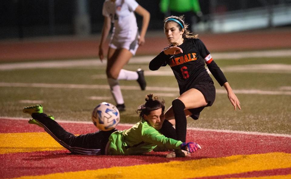 Oakdale’s Kyndra Obermeyer challenges the Kimball goalie during the Valley Oak League game with Kimball in Oakdale, Calif., Friday, Jan. 20, 2023.
