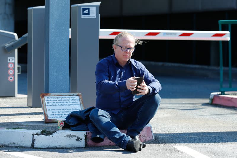 Baublies, speaker of Lufthansa's cabin crew union (UFO) sits in front of the Lufthansa headquarters in Frankfurt