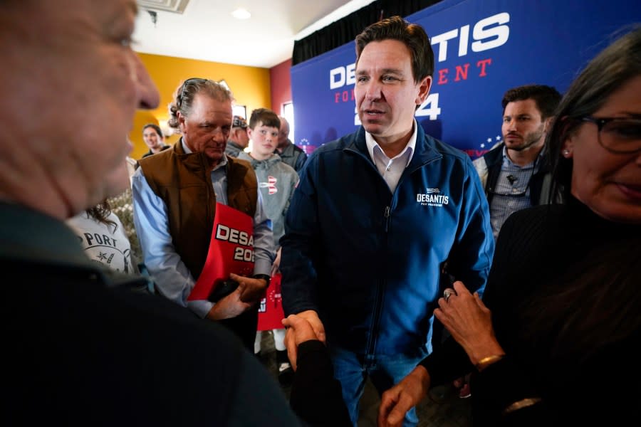 FILE – Republican presidential candidate Florida Gov. Ron DeSantis talks with audience members during a meet and greet, Friday, Nov. 3, 2023, in Denison, Iowa. Former President Donald Trump was the first choice of 51% of likely Iowa caucus participants in a Des Moines Register-NBC News-Mediacom Iowa Poll published Monday, Dec. 11. Florida Gov. Ron DeSantis, who has vowed that he will win Iowa, had the support of 19%. (AP Photo/Charlie Neibergall, File)