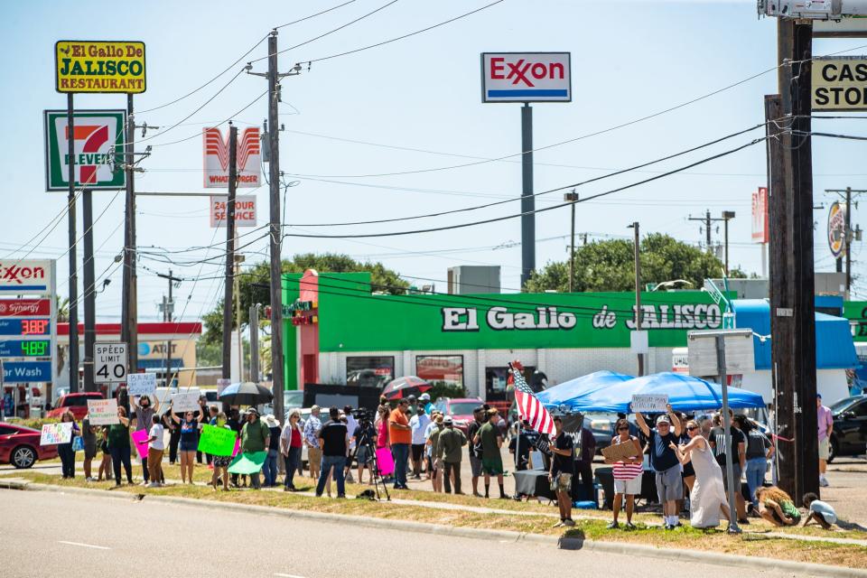 Protesters against County Citizens Defending Freedom and counterprotesters demonstrate at 10309 South Padre Island Drive on Saturday, July 9, 2022. CCDF, a conservative action group, offered instruction to community members on how to monitor and influence curriculum on topics such as sex education in local schools.