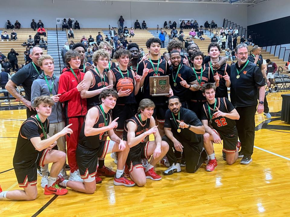 Worthington Christian celebrates its Division III district title after defeating Central Buckeye League rival Columbus Academy 60-47 on Thursday at Ohio Dominican.