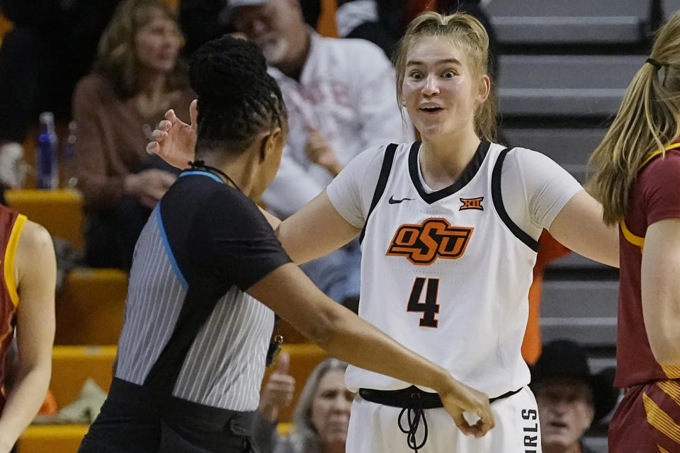 Oklahoma State guard Anna Gret Asi (4) reacts after being called for a foul in the second half of an NCAA college basketball game against Iowa State, Wednesday, Feb. 22, 2023, in Stillwater, Okla. (AP Photo/Sue Ogrocki)