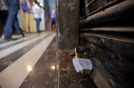 A sealed lock is seen at the door of a Punjab National Bank branch after it was sealed by India's federal police in Mumbai, India, February 19, 2018. REUTERS/Francis Mascarenhas