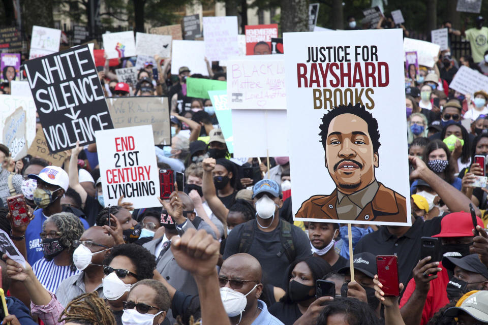 A crowd of demonstrators march to the Capitol Monday, June 15, 2020 in Atlanta. The NAACP March to the Capitol coincided with the restart of the Georgia 2020 General Assembly. Lawmakers returned wearing masks and followed new rules to restart the session during the pandemic. (Steve Schaefer/Atlanta Journal-Constitution via AP)
