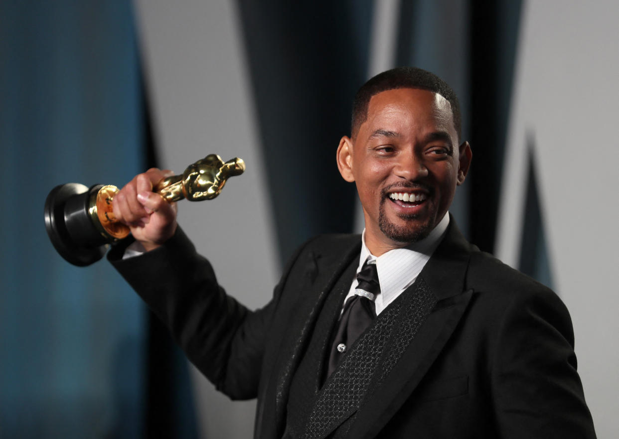Will Smith poses with his Oscar as he arrives at the Vanity Fair Oscar party during the 94th Academy Awards in Beverly Hills, California, U.S., March 27, 2022