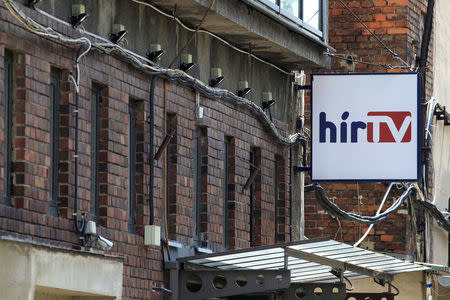 The logo of the Hungarian news television channel, Hir TV, is seen on a building in Budapest, Hungary, August 1, 2018. REUTERS/Bernadett Szabo