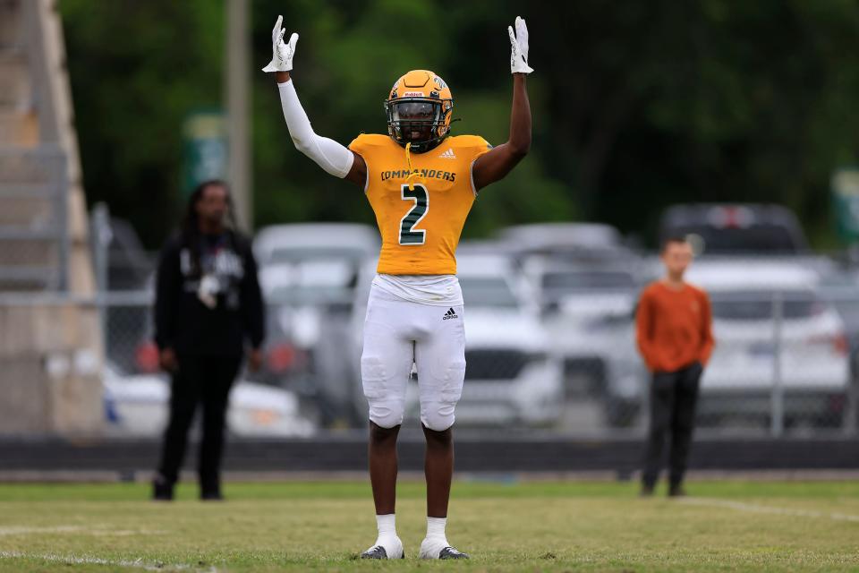 Ed White's Joshua Patterson (2) gestures toward the sidelines during the first quarter of a spring high school football game against Bolles.