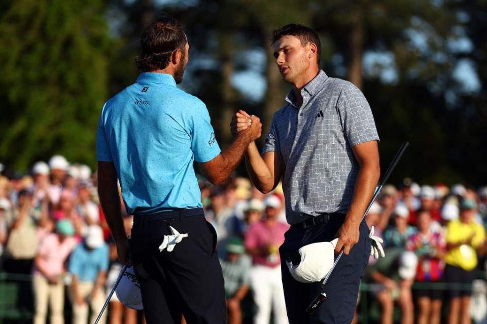 Max Homa, left, and Ludvig Aberg of Sweden shake hands on the 18th green after finishing their rounds.