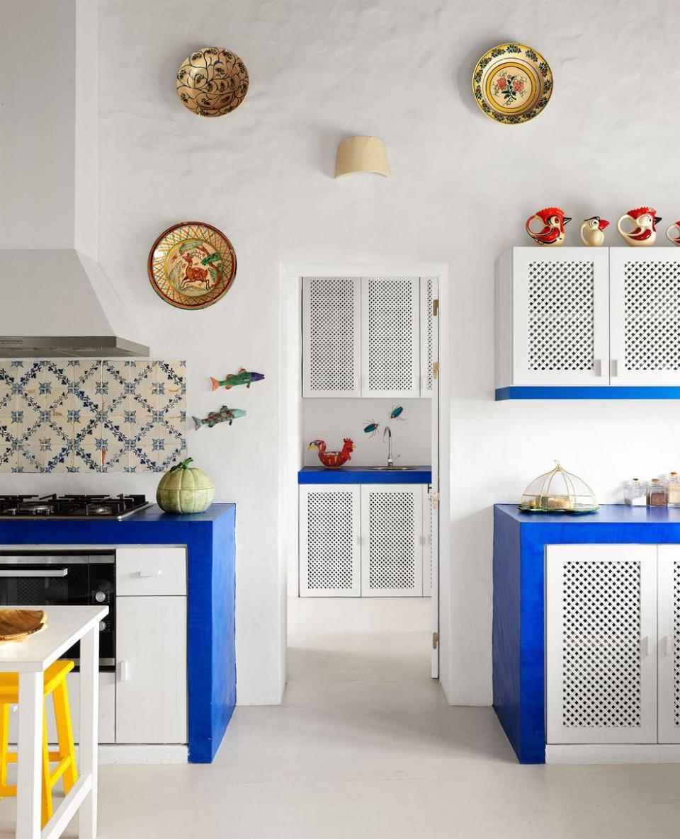 a kitchen with white cabinets