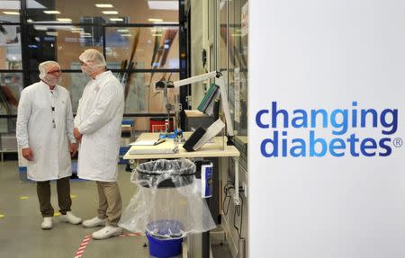 FILE PHOTO: Employees stand in the insulin production plant of Danish multinational pharmaceutical company Novo Nordisk in Chartres, north-central France, April 21, 2016. REUTERS/Guillaume Souvant/Pool/File Photo