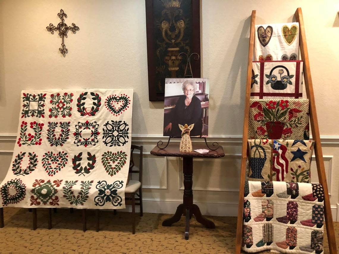 A portrait of Verna Mae Brashear and her completed quilt works.