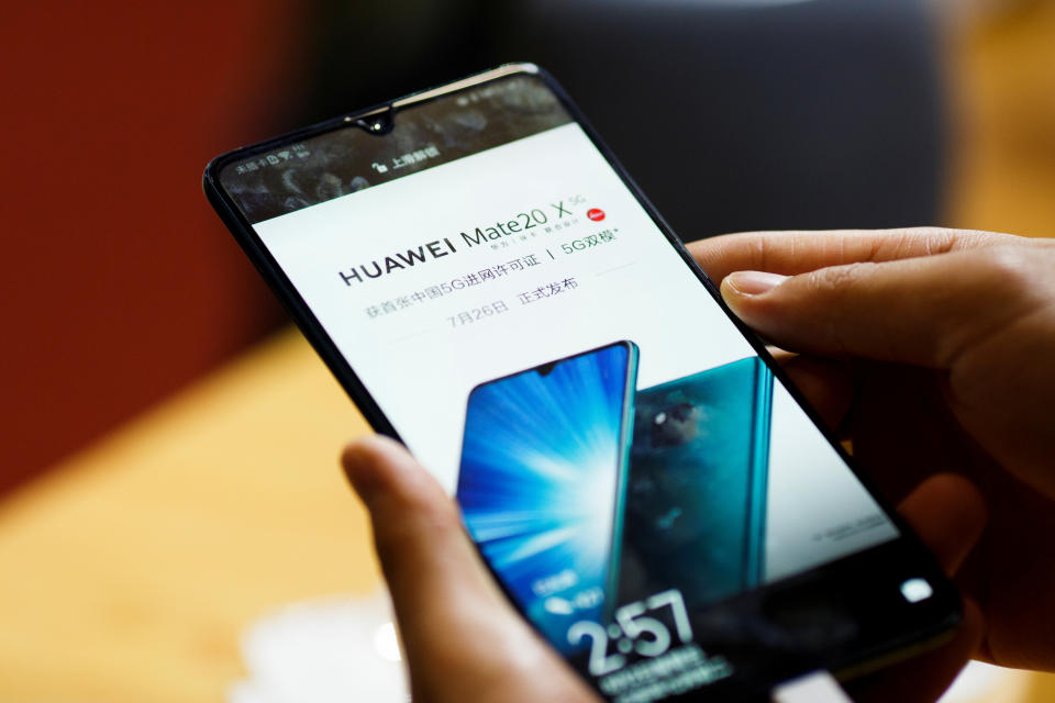 A man holds a Huawei Mate 20 X 5G smartphone at the International Consumer Electronics Expo in Beijing, China August 2, 2019. REUTERS/Thomas Peter