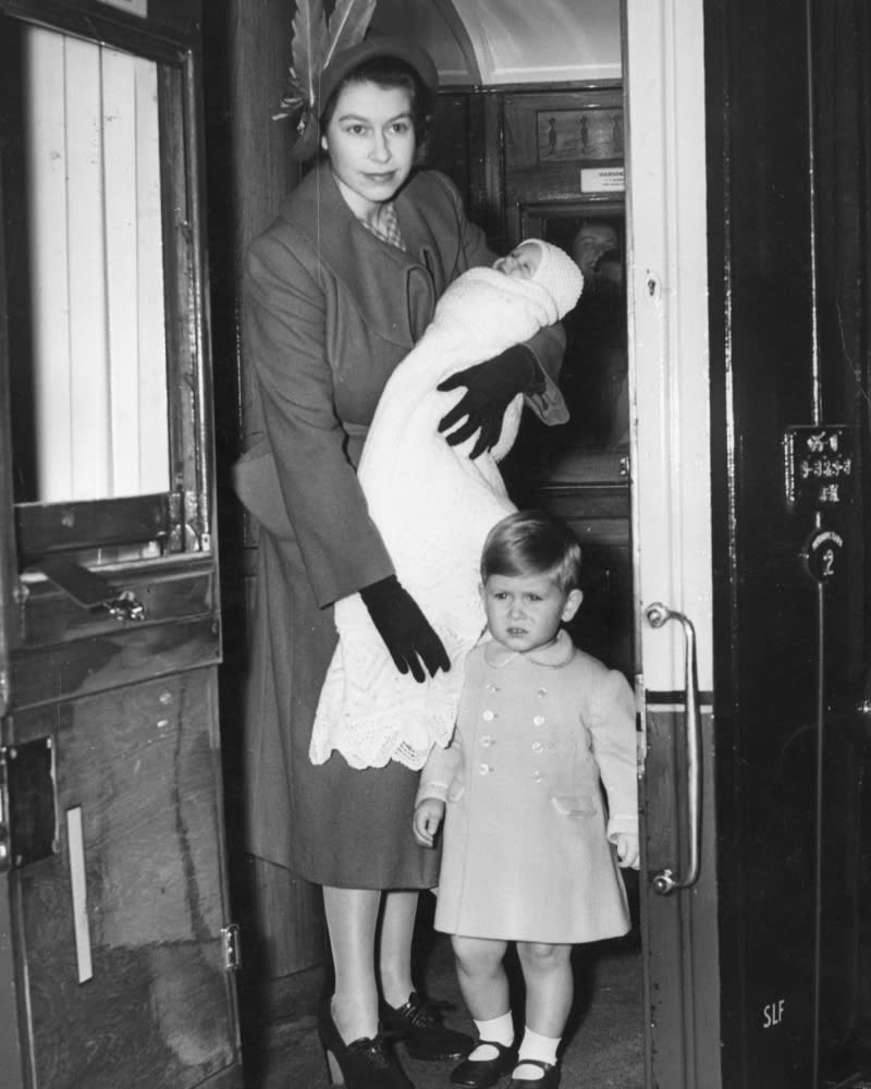 <p> In one of the earliest pictures of King Charles and Princess Anne, the then-Princess Elizabeth boarded a first-class railway carriage en route to Balmoral Castle in 1950. She's seen cradling baby Princess Anne, while a young King Charles dutifully stands beside his mother and sister, dressed up for the occasion in a smart double-breasted coat. </p>