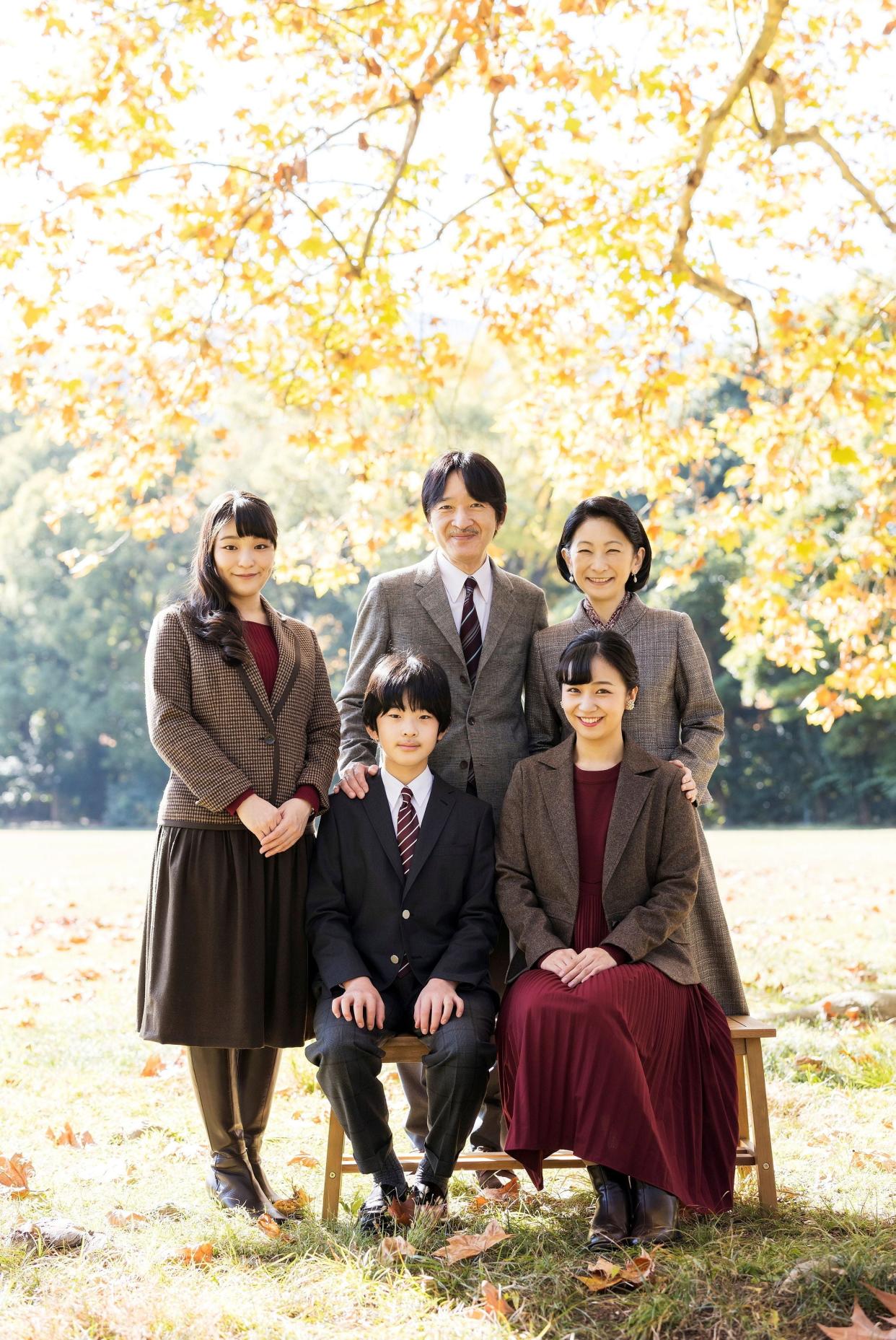 <p>Japan’s Crown Prince Akishino (behind C) with his wife Crown Princess Kiko (behind R) and their children.</p> (via REUTERS)