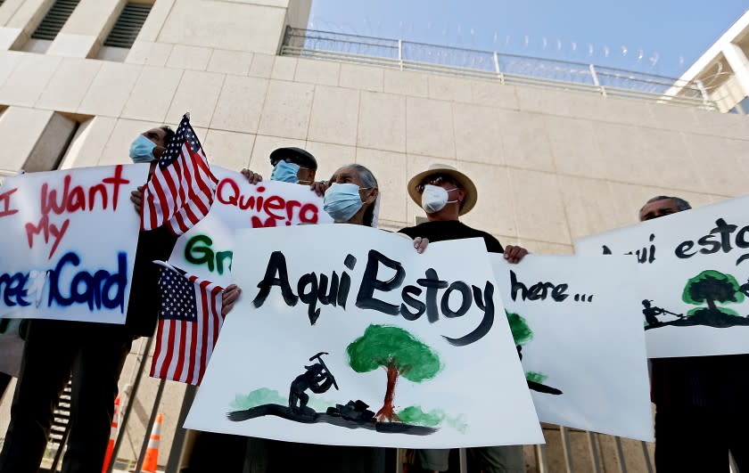 Immigrant advocates demonstrate outside a federal detention center in Los Angeles.