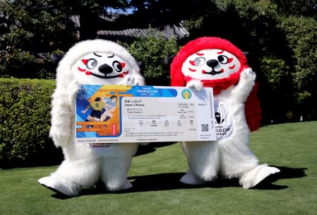 FILE PHOTO: Ren and G, official mascots for the 2019 Rugby World Cup in Japan, hold a big replica of the Rugby World Cup ticket in Tokyo