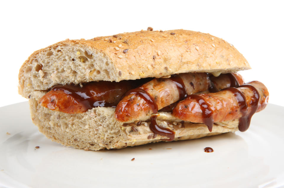 Sausages in a wholemeal baguette with brown/barbecue sauce