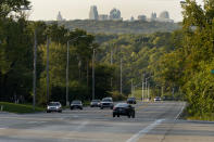 Cars travel on a stretch of Blue Parkway Thursday, Sept. 24, 2020, in Kansas City, Mo. The stretch of road, along with parts of two other streets, would be renamed to honor Rev. Martin Luther King Jr. under a city proposal coming in the wake of failed effort to honor King last year. (AP Photo/Charlie Riedel)