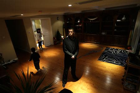 Student Ding Kun stands guard in a villa during field training for Tianjiao Special Guard/Security Consultant on the outskirts of Beijing December 12, 2013. REUTERS/Jason Lee