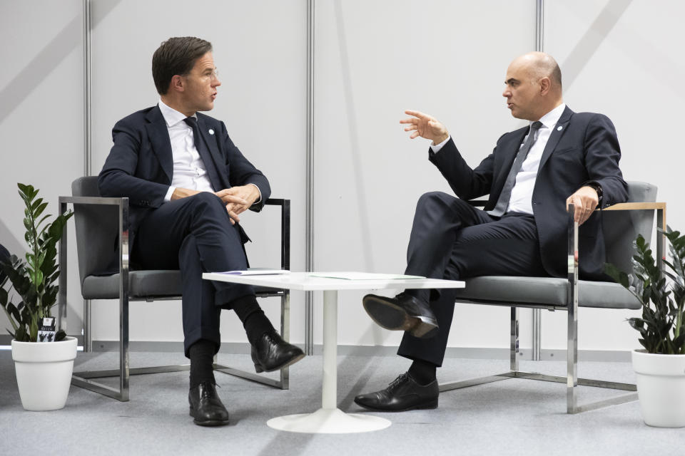 Swiss Federal President Alain Berset, right, talks to Dutch Prime Minister Mark Rutte, during a bilateral meeting during the COP24 United Nations Climate Change Conference in Katowice, Poland, Monday, Dec. 3, 2018. (Peter Klaunzer/Keystone via AP)