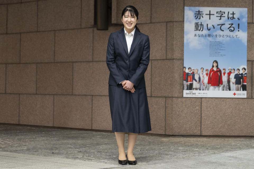 Japan's Princess Aiko, the daughter of Emperor Naruhito and Empress Masako, poses for the media at the Japanese Red Cross Society as she begins to work on Monday, April 1, 2024. (Yuichi Yamazaki/Pool Photo via AP)