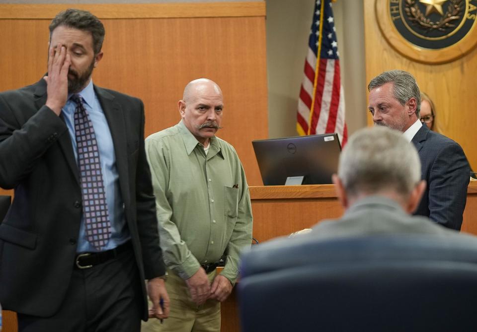 Travis Hall, center, takes the stand in the 26th District Court in Williamson County on Wednesday. He was sentenced Thursday to 99 years in prison and ordered to pay a $10,000 fine.