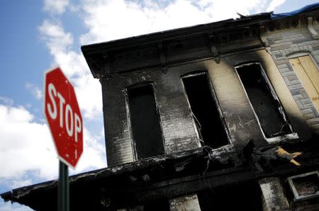 A store damaged from riots after the death of Freddie Gray is seen in Baltimore, Maryland, May 13, 2015. REUTERS/Carlos Barria