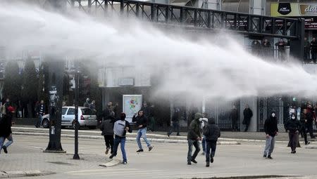 Police spray water cannons at protesters during clashes in Pristina, Kosovo January 9, 2016. REUTERS/Agron Beqiri