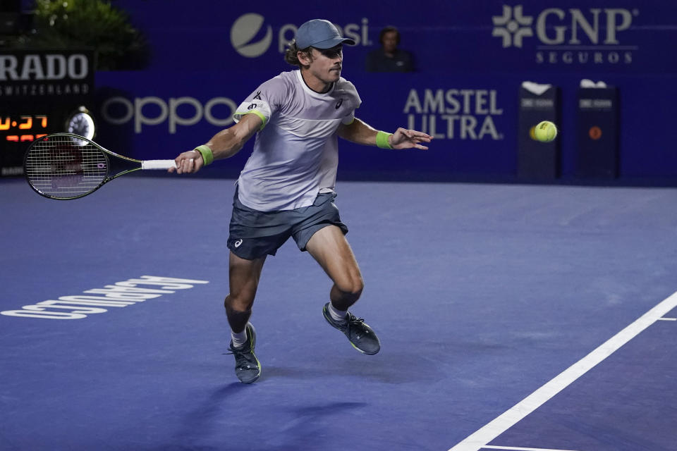 Alex de Minaur of Australia plays a forehand return to Tommy Paul of the United States in the final match at the Mexican Open tennis tournament in Acapulco, Mexico, Saturday, March 4, 2023. (AP Photo/Eduardo Verdugo)