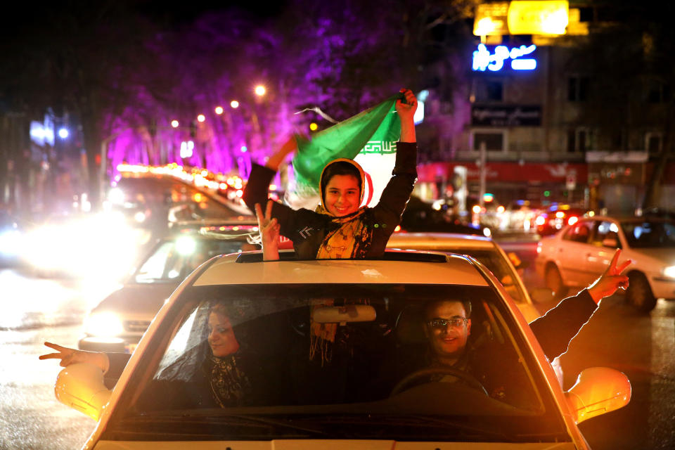 Iranians celebrate on a street in northern Tehran, Iran, Thursday, April 2, 2015, after Iran's nuclear agreement with world powers in Lausanne, Switzerland.  (AP Photo/Ebrahim Noroozi)