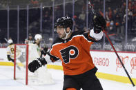 FILE - Philadelphia Flyers' Shayne Gostisbehere celebrates after scoring a goal past Boston Bruins goaltender Jeremy Swayman (1) during the first period of an NHL hockey game in Philadelphia, in this Saturday, April 10, 2021, file photo. NHL teams wasted little time making moves once the roster freeze for the Seattle expansion draft was lifted. Carolina traded goaltender Alex Nedeljkovic to Detroit for a third-round pick and the rights to pending free agent Jonathan Bernier. Philadelphia send second- and seventh-round picks in 2022 to Arizona to take Shayne Gostisbehere and his hefty contract. And the New York Rangers signed back-to-back Stanley Cup champion Barclay Goodrow to a six-year contract the Lightning could not have afforded. (AP Photo/Derik Hamilton, File)