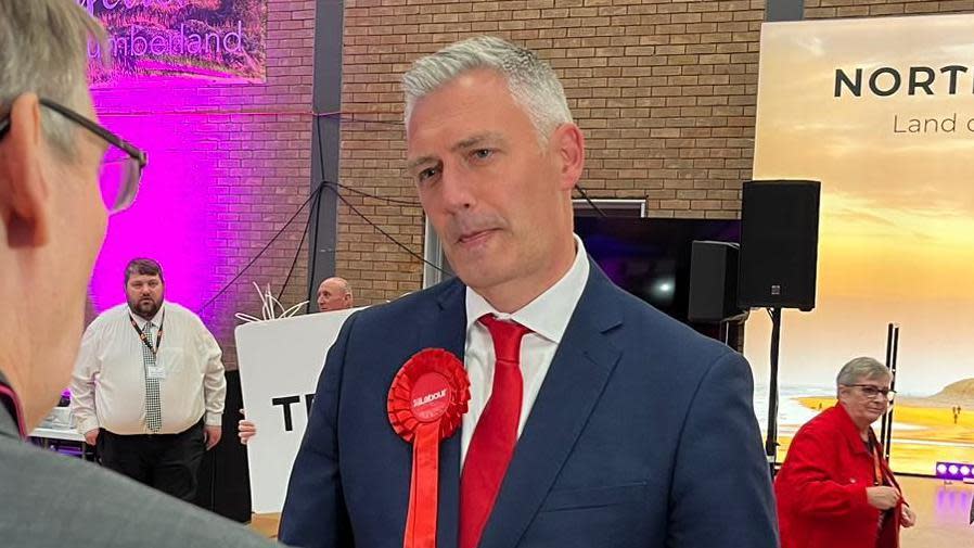 A man in a red tie 