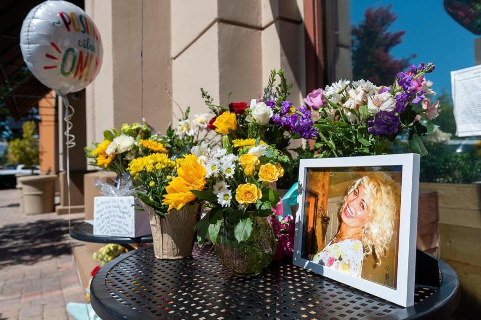 A memorial is set up outside the House of Oliver restaurant for Vita Joga, who worked as a waitress at the restaurant, in June 2022 in Roseville. She was shot to death while at work the day before.