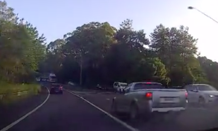 The footage showed the ute driver speeding around the vehicle before pulling up in front. Source: Facebook/Dash cam owners Australia