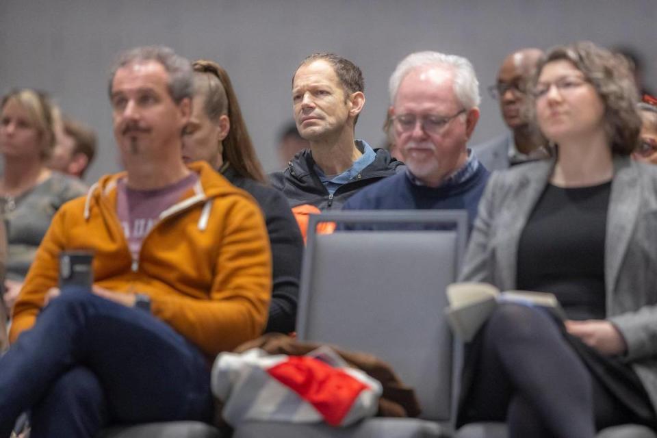 Attendees listen to a presentation during a University of Kentucky Board of Trustees meeting at the Gatton Student Center on the UK campus in Lexington, Ky., on Friday, Feb. 23, 2024.