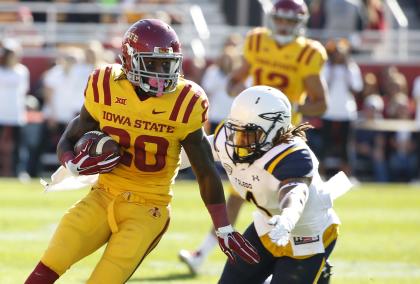 Running back DeVondrick Nealy #20 of the Iowa State Cyclones is tackled by defensive back Jordan Haden #4 of the Toledo Rockets in the first half of play at Jack Trice Stadium on October 11, 2014 in Ames, Iowa. (Photo by David Purdy/Getty Images)