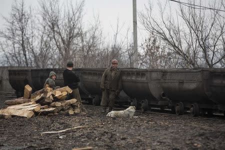 Miners stand outside Zasyadko coal mine in Donetsk March 4, 2015. REUTERS/Baz Ratner