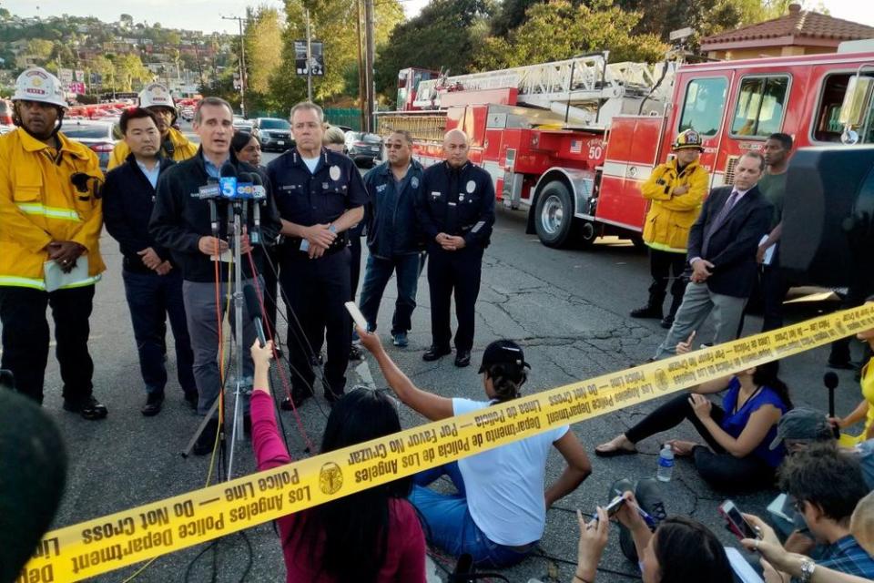 L.A. Mayor Eric Garcetti (at microphone) speaks following what police called a hostage situation at a Trader Joe's in the the city's Silver Lake neighborhood, in which one woman was killed.