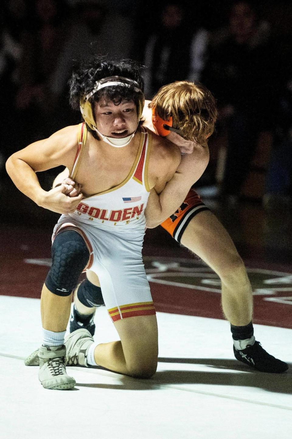 Golden Valley’s Chufu Her wrestles Merced’s Mike Wilson during a match at Golden Valley High School in Merced, Calif., on Tuesday, Jan. 23, 2024.