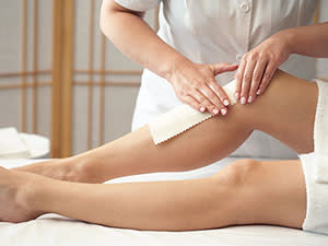 woman getting leg waxed