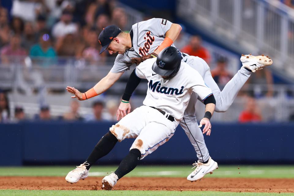 Zack Short of the Detroit Tigers and Jon Berti  of the Miami Marlins collide during the sixth inning of the game at loanDepot park in Miami on Sunday, July 30, 2023.