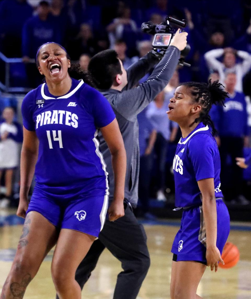 Seton Hall forward Sidney Cooks (14) and Seton Hall guard Lauren Park-Lane (3) celebrate beating MTSU during the Final 4 gmae of the WNIT, on Thursday, March 31, 2022, at MTSU.