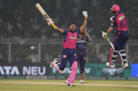 Rajasthan Royals' Jos Buttler and Avesh Khan celebrate their win against Kolkata Knight Riders during the Indian Premier League cricket match in Kolkata, India, Tuesday, April 16, 2024. (AP Photo/Bikas Das)