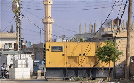 An electricity generator is seen in the town of Amuda, December 7, 2013. Picture taken December 7, 2013. REUTERS/Rodi Said