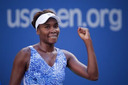 Venus Williams of the U.S. celebrates after defeating Anett Kontaveit of Estonia during their fourth round match at the U.S. Open Championships tennis tournament in New York, September 6, 2015. REUTERS/Eduardo Munoz
