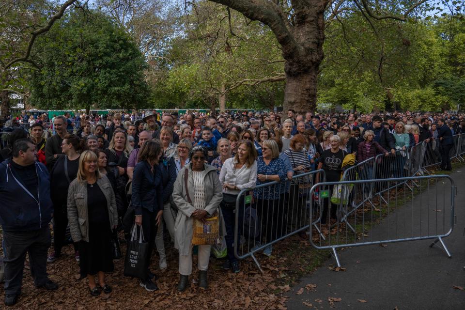 People stand in a queue to pay their respects to the late Queen Elizabeth II (AP)