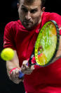 Canada's Steven Diez returns the ball to Sweden's Elias Ymer during their Davis Cup tennis match at the Madrid Arena stadium in Madrid, Spain, Thursday, Nov. 25, 2021. (AP Photo/Manu Fernandez)